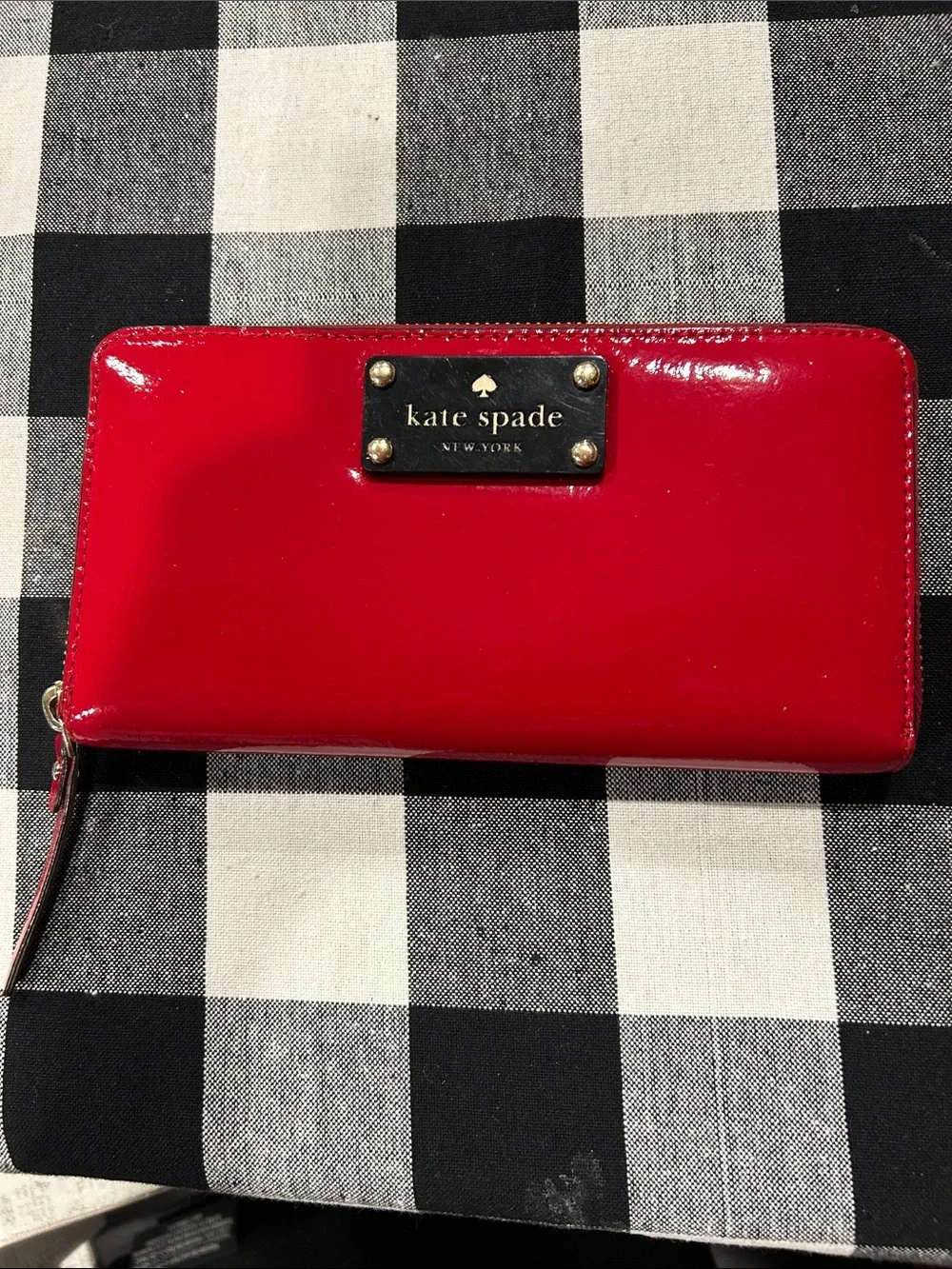 Kate Spade glossy red patent zip wallet with gold plaque